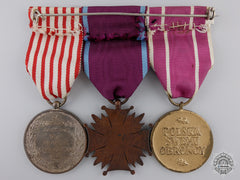 A Polish Medal Bar With Three Awards