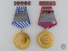 Two Mint Yugoslavian Medals In Packets Of Issue