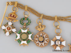 A Early 20Th Century French Gold Miniature Group Of Nine