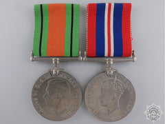 Two Second War British Issue Service Medals With Container
