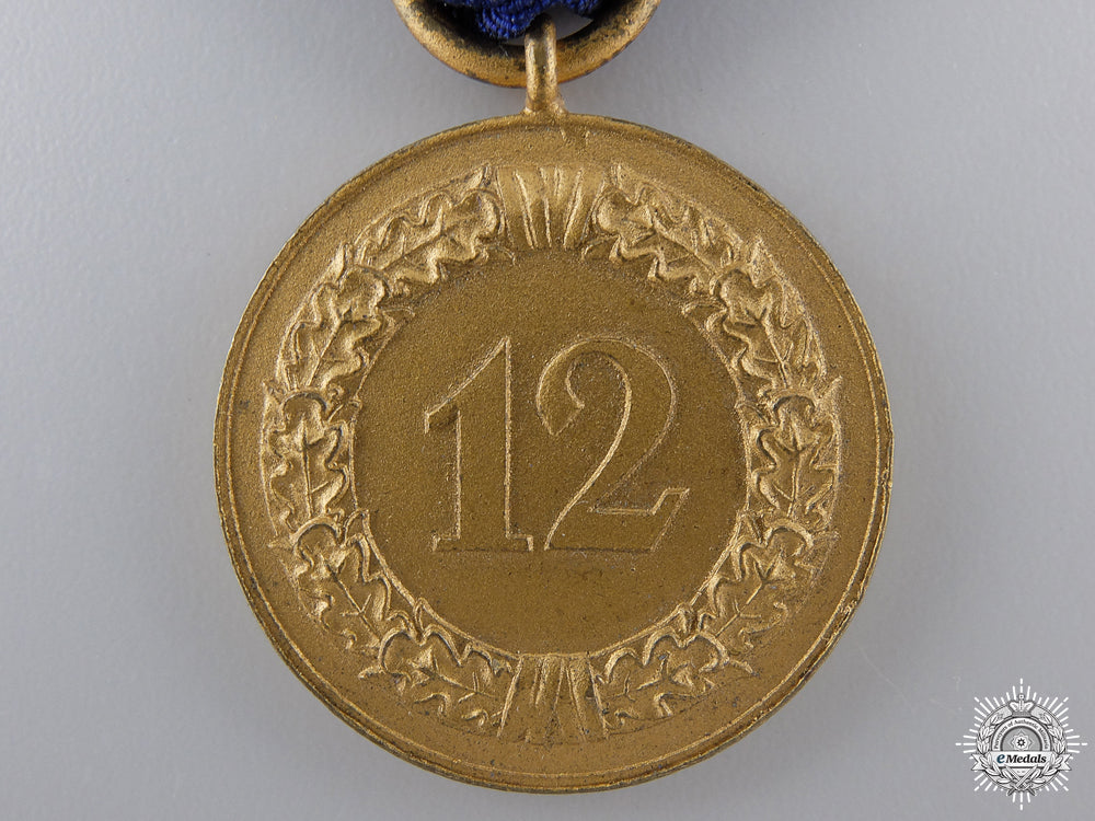 a_wehrmacht_long_service_award;_third_class_for12_years_service_img_03.jpg54eca7af47590