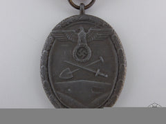 A West Wall Medal With Packet Of Issue