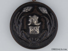 A Manchukuo National Foundation Merit Medal