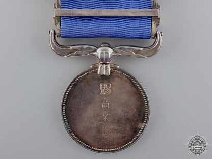 a_japanese_civic_merit_medal_with_case;_named_img_06.jpg54c3c3499f551