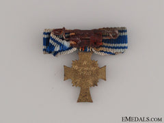 A Miniature Gold Grade Mother's Cross