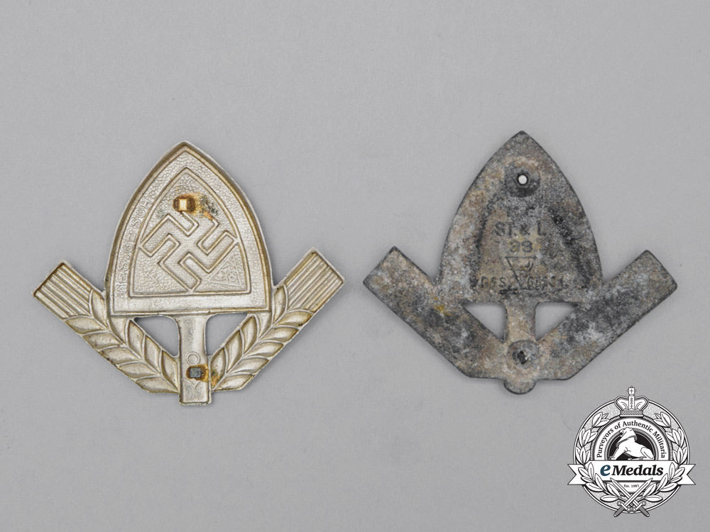 a_grouping_of_two_rad(_national_labour_service)_cap_badges_j_099_1