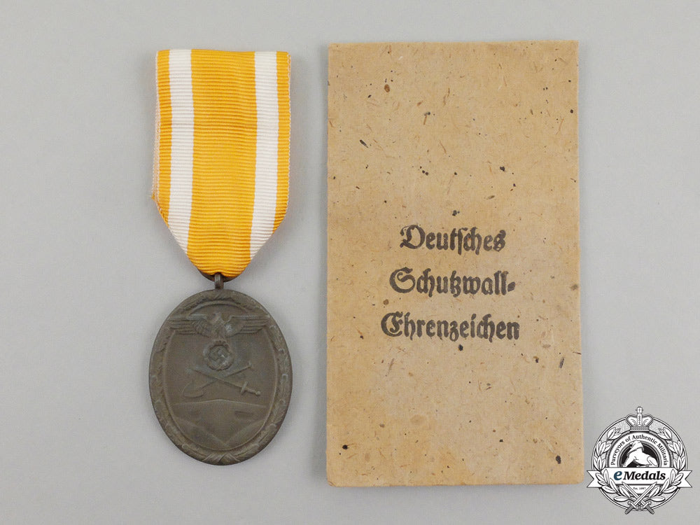 a_german_west_wall_medal_in_its_original_packet_of_issue_by_carl_poellath_j_789_1