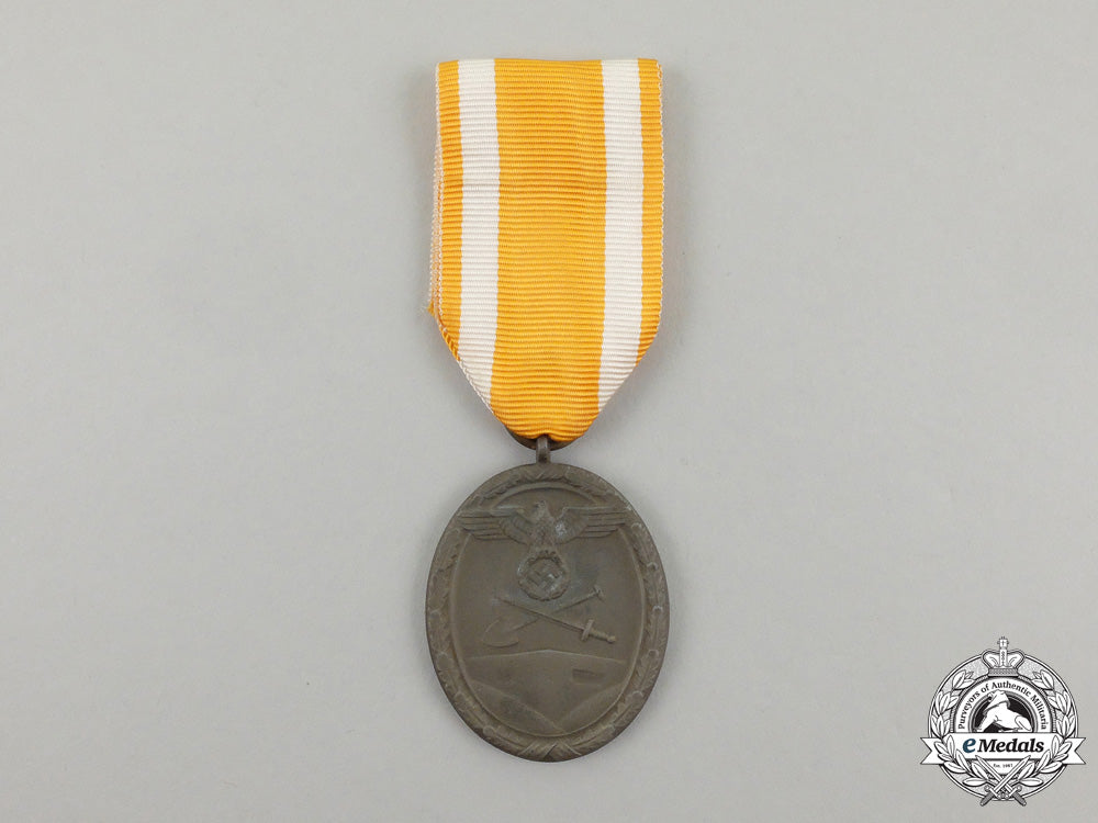 a_german_west_wall_medal_in_its_original_packet_of_issue_by_carl_poellath_j_790_1