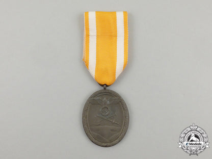 a_german_west_wall_medal_in_its_original_packet_of_issue_by_carl_poellath_j_790_1
