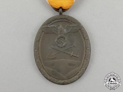 a_german_west_wall_medal_in_its_original_packet_of_issue_by_carl_poellath_j_791