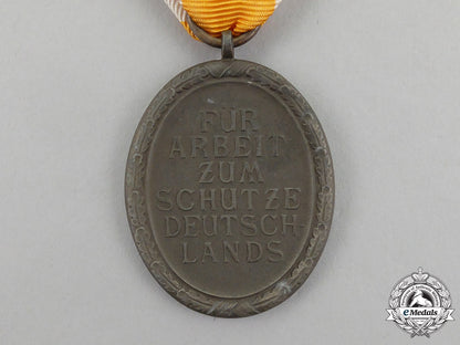 a_german_west_wall_medal_in_its_original_packet_of_issue_by_carl_poellath_j_792