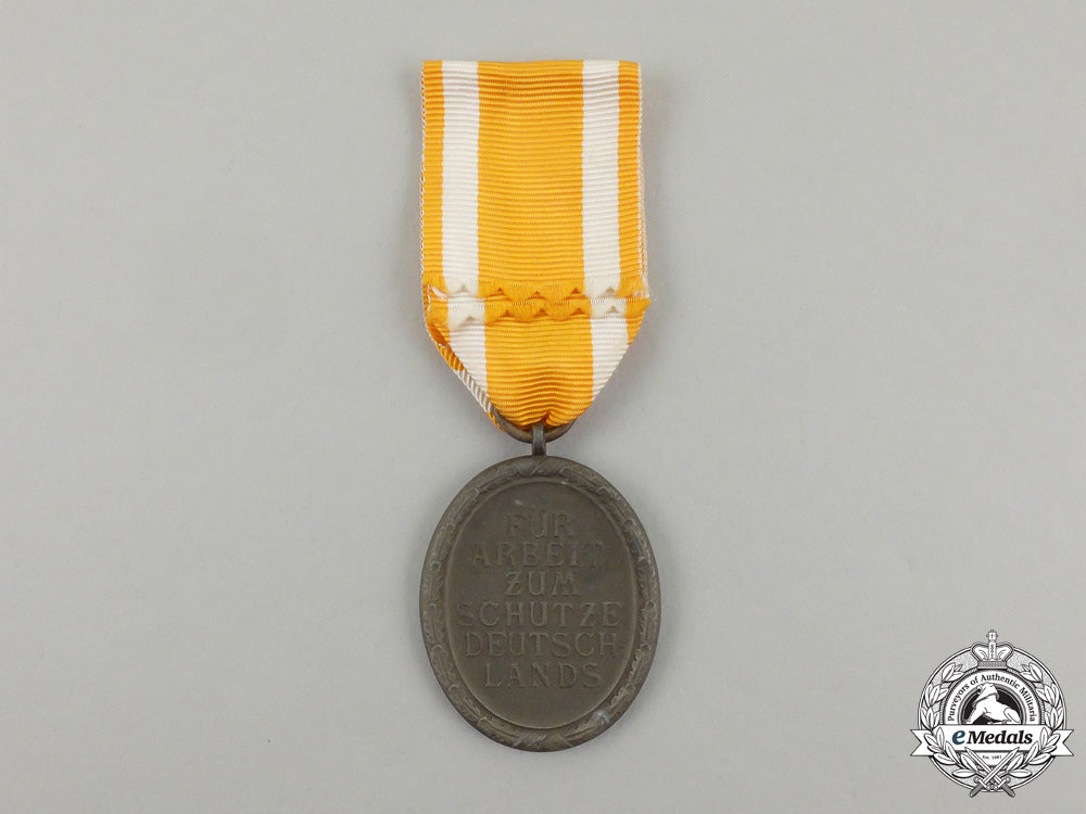 a_german_west_wall_medal_in_its_original_packet_of_issue_by_carl_poellath_j_793