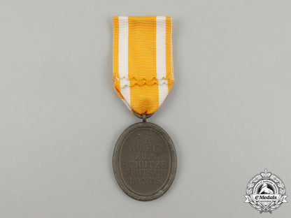 a_german_west_wall_medal_in_its_original_packet_of_issue_by_carl_poellath_j_793