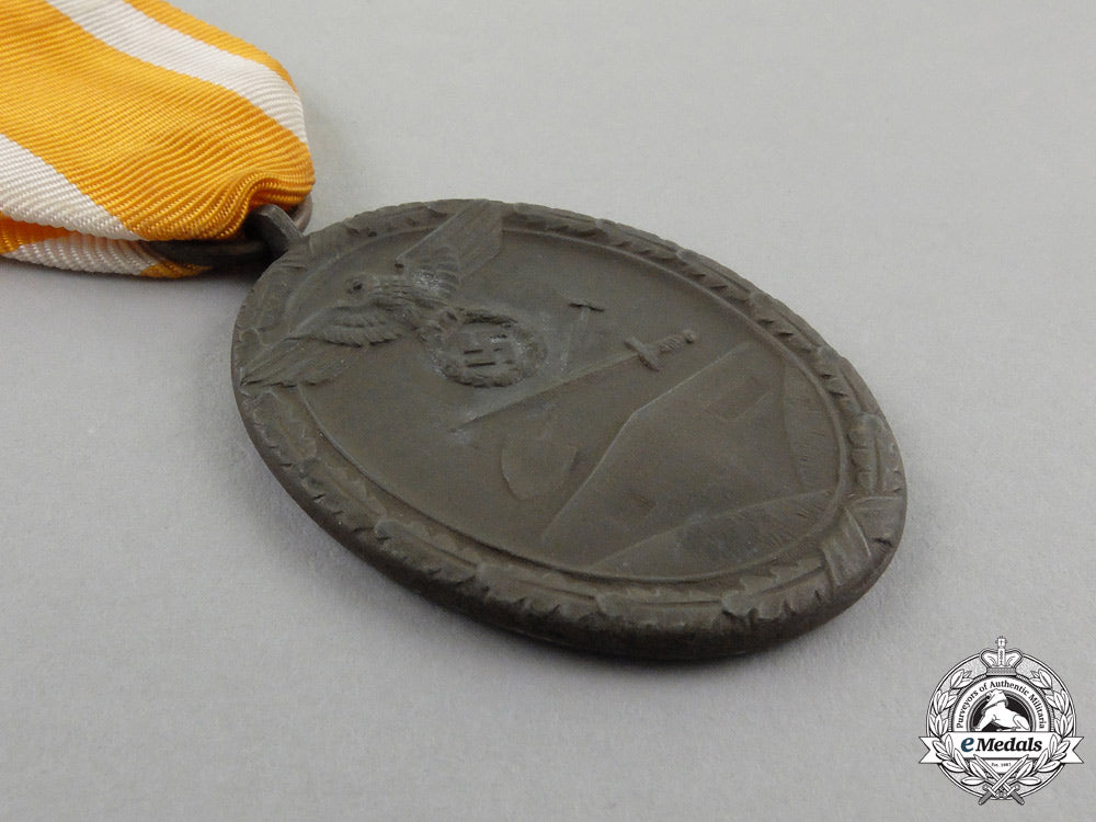 a_german_west_wall_medal_in_its_original_packet_of_issue_by_carl_poellath_j_794