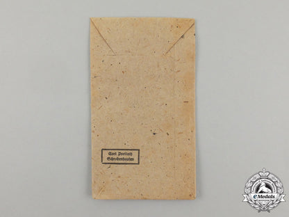 a_german_west_wall_medal_in_its_original_packet_of_issue_by_carl_poellath_j_795