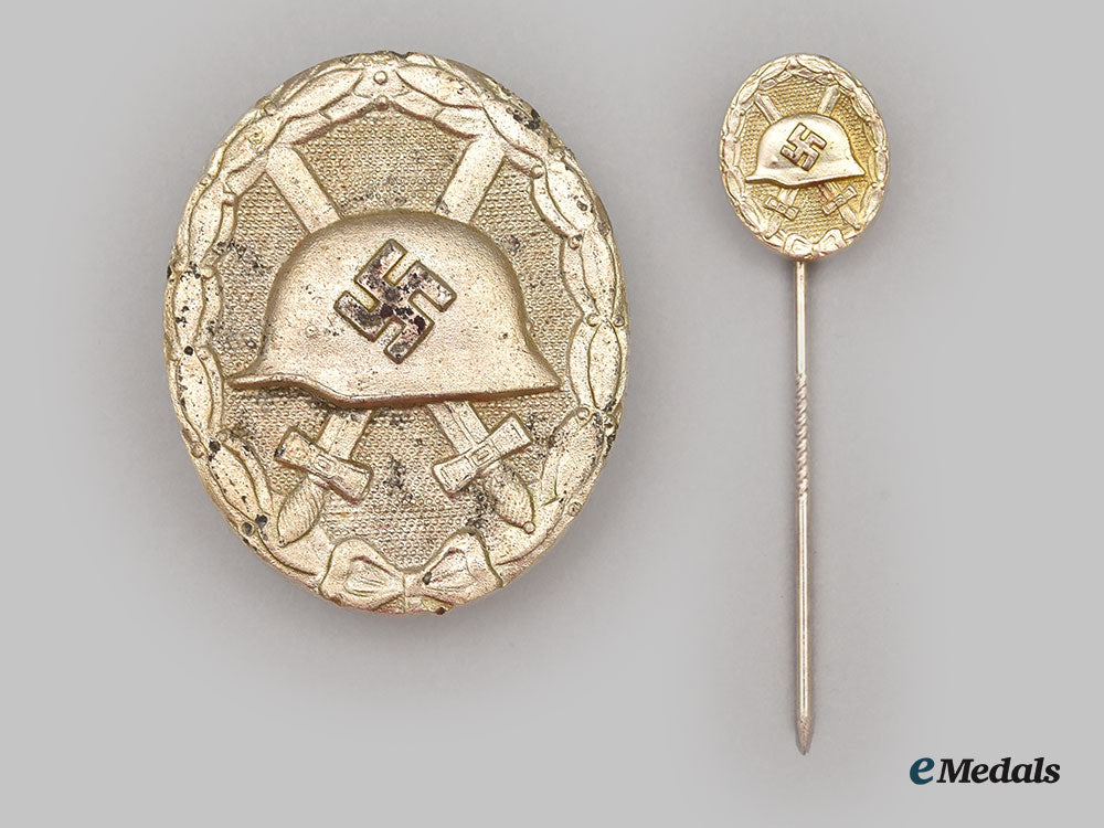 germany,_wehrmacht._a_silver_grade_wound_badge,_with_case_and_stick_pin_miniature,_by_wächtler&_lange_l22__mnc4203_114