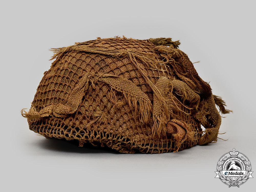 germany,_wehrmacht._an_m42_stahlhelm,_with_netting_and_hessian_cloth_cover_l22_mnc0041_922