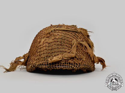 germany,_wehrmacht._an_m42_stahlhelm,_with_netting_and_hessian_cloth_cover_l22_mnc0044_923