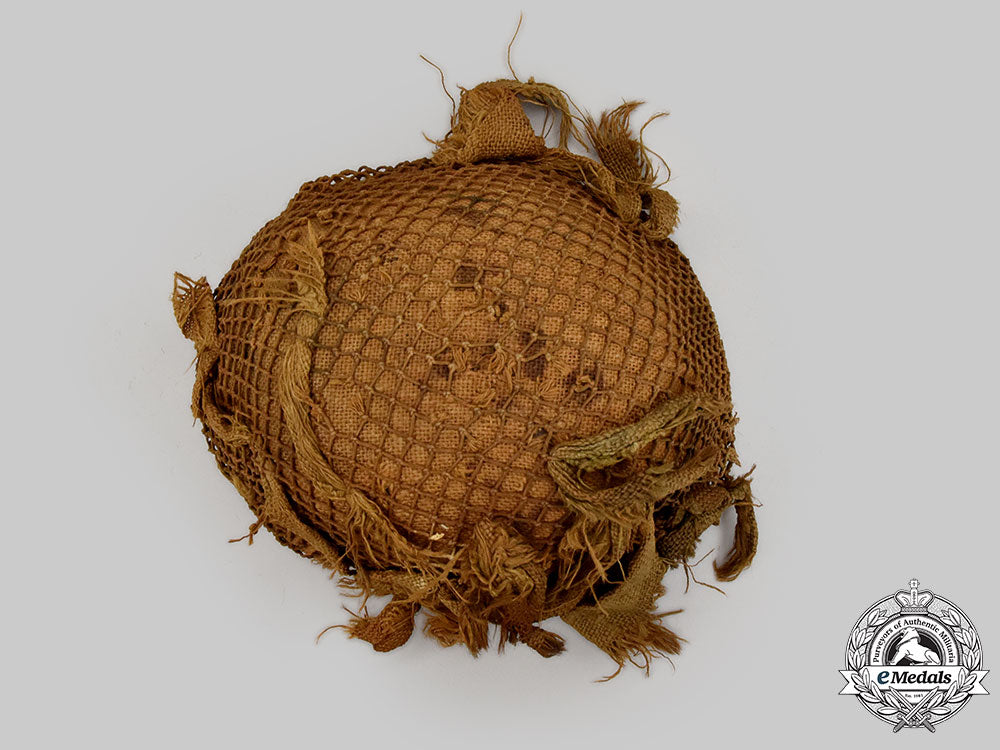germany,_wehrmacht._an_m42_stahlhelm,_with_netting_and_hessian_cloth_cover_l22_mnc0049_927
