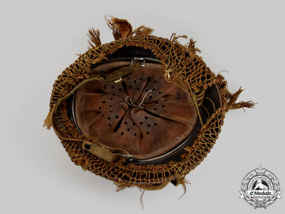 germany,_wehrmacht._an_m42_stahlhelm,_with_netting_and_hessian_cloth_cover_l22_mnc0059_928