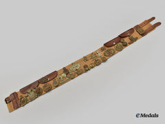 United Kingdom. A First World War Belt With Souvenir Buttons And Cap Badges