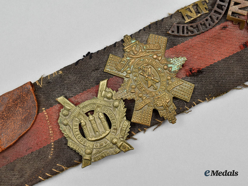 united_kingdom._a_unique_belt_with_souvenir_buttons_and_cap_badges_l22_mnc0307_570