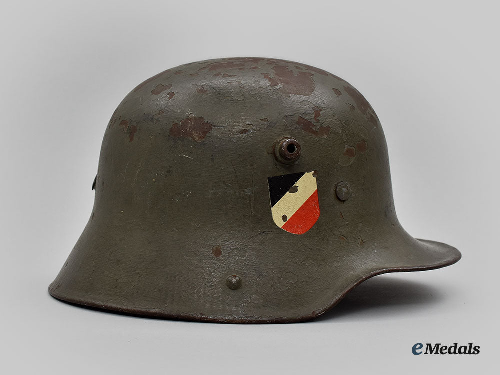 germany,_heer._an_m16_transitional_steel_helmet,_named_and_unit-_attributed_l22_mnc0652_751_1