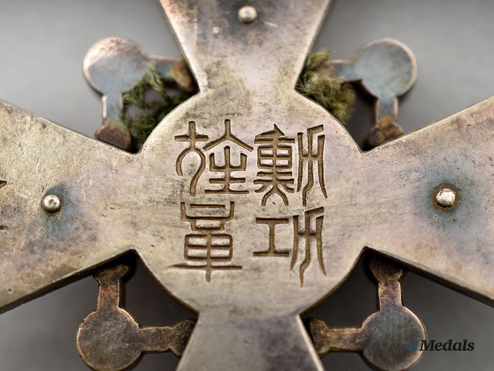 japan,_empire._an_order_of_the_sacred_treasure,_vi_class,_cased_with_award_document1944_l22_mnc1996_317_1