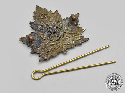 canada,_cef._a_royal_canadian_garrison_artillery_cap_badge,_style"_d"_with_maple_leaf_and"_overseas"_scroll_l22_mnc4408_274