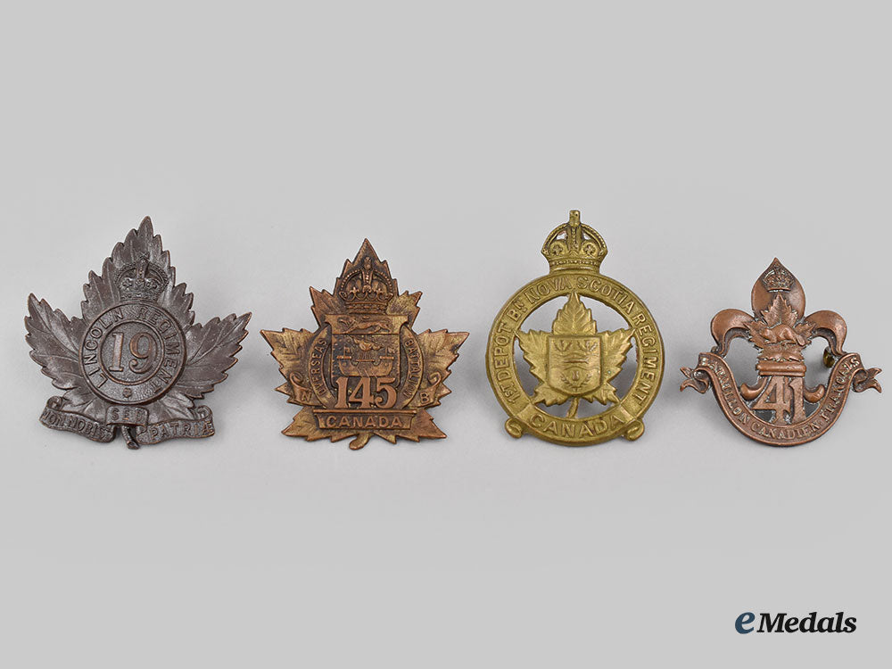 canada,_cef._a_lot_of_four_first_war_cap_badges_l22_mnc5031_654