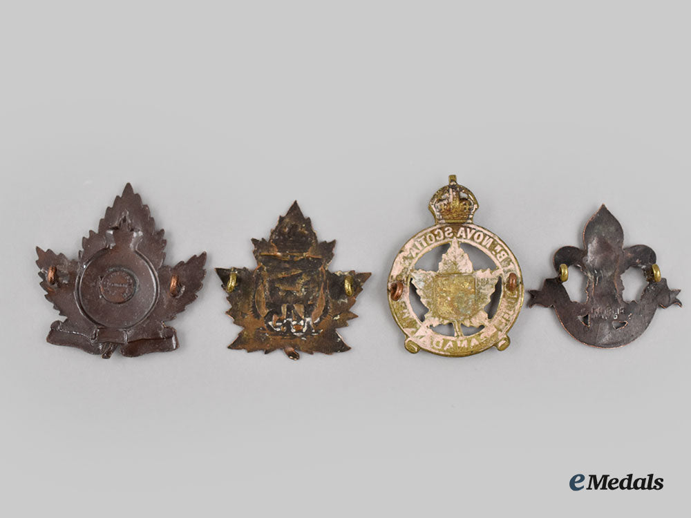 canada,_cef._a_lot_of_four_first_war_cap_badges_l22_mnc5033_655