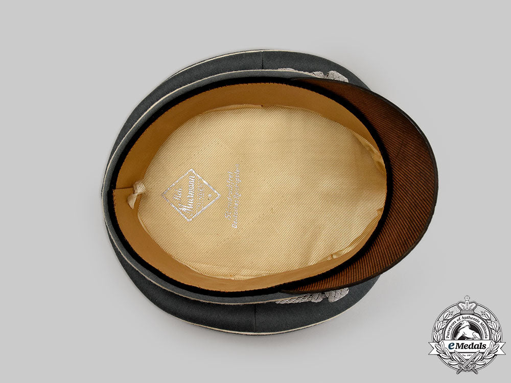 germany,_ss._a_rare_waffen-_ss_officer’s_visor_cap_with_collar_tab_totenkopf,_by_heinrich_muermann_l22_mnc6406_410