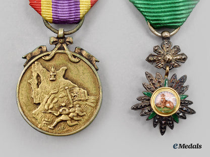 iran,_pahlavi_empire._a_miniature_order_of_the_lion_and_sun_and_a_miniature_war_medal_l22_mnc6594_186