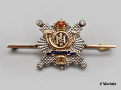 United Kingdom. A Gold Highland Light Infantry Regimental Pin With Diamonds