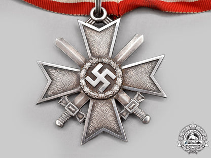 germany,_wehrmacht._a_rare_knight’s_cross_of_the_war_merit_cross_with_swords,_in_silver,_by_deschler&_sohn_l22_mnc7256_514