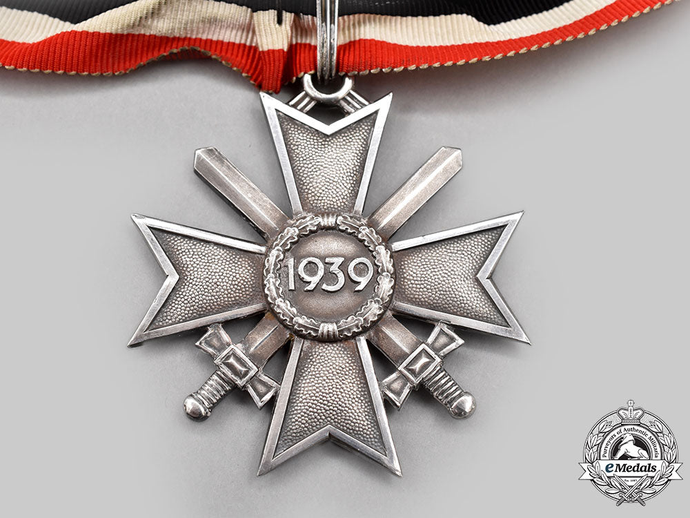 germany,_wehrmacht._a_rare_knight’s_cross_of_the_war_merit_cross_with_swords,_in_silver,_by_deschler&_sohn_l22_mnc7257_515