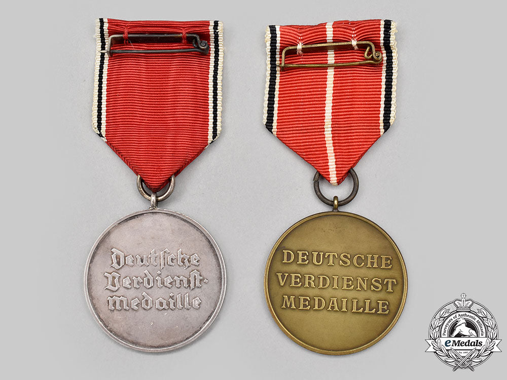 germany,_third_reich._a_pair_of_merit_medals_of_the_order_of_the_german_eagle,_bronze_and_silver_grades_l22_mnc7275_521