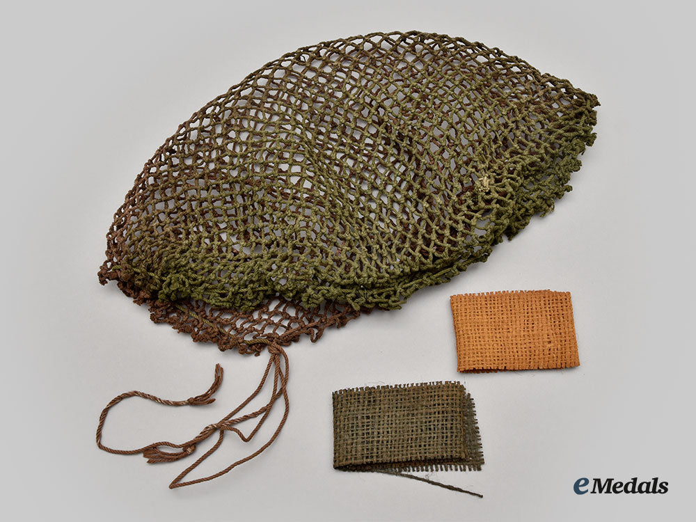 canada,_commonwealth._a_mark_ii_brodie_helmet,_with_camo_helmet_netting_and_repair_kit_l22_mnc7612_968