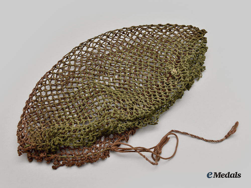 canada,_commonwealth._a_mark_ii_brodie_helmet,_with_camo_helmet_netting_and_repair_kit_l22_mnc7618_970