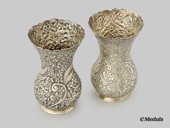 United Kingdom. A Set Of Two Floral Patterned Silver Flower Vases