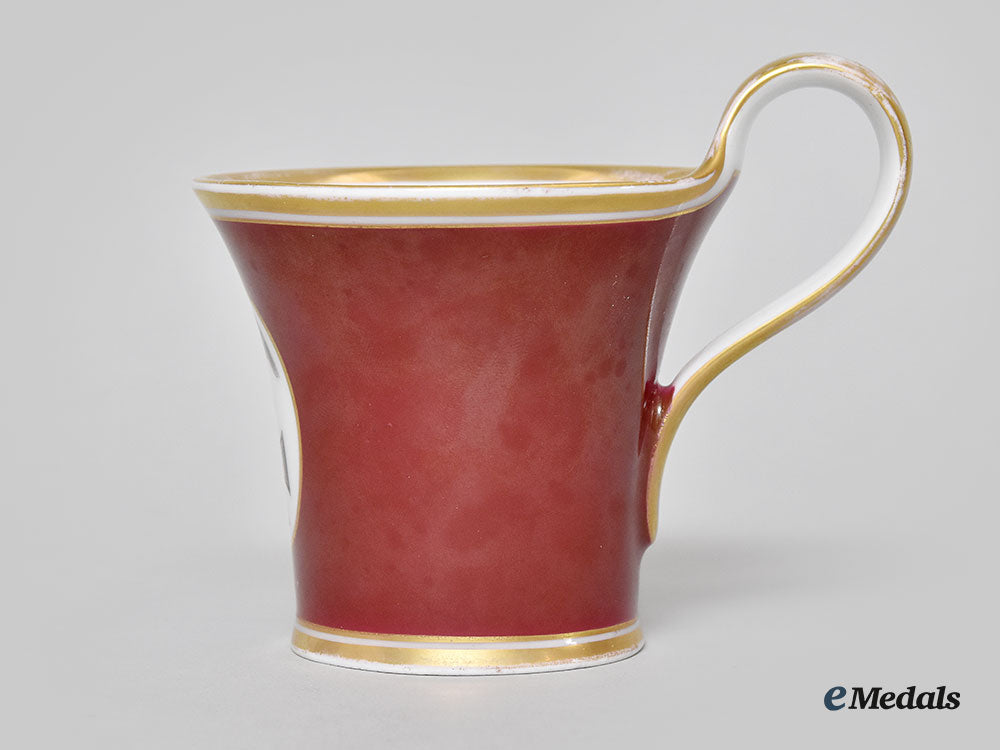 germany,_imperial._a_red_glazed_porcelain_iron_cross_mug,_by_furstenberg_l22_mnc9147_394_1