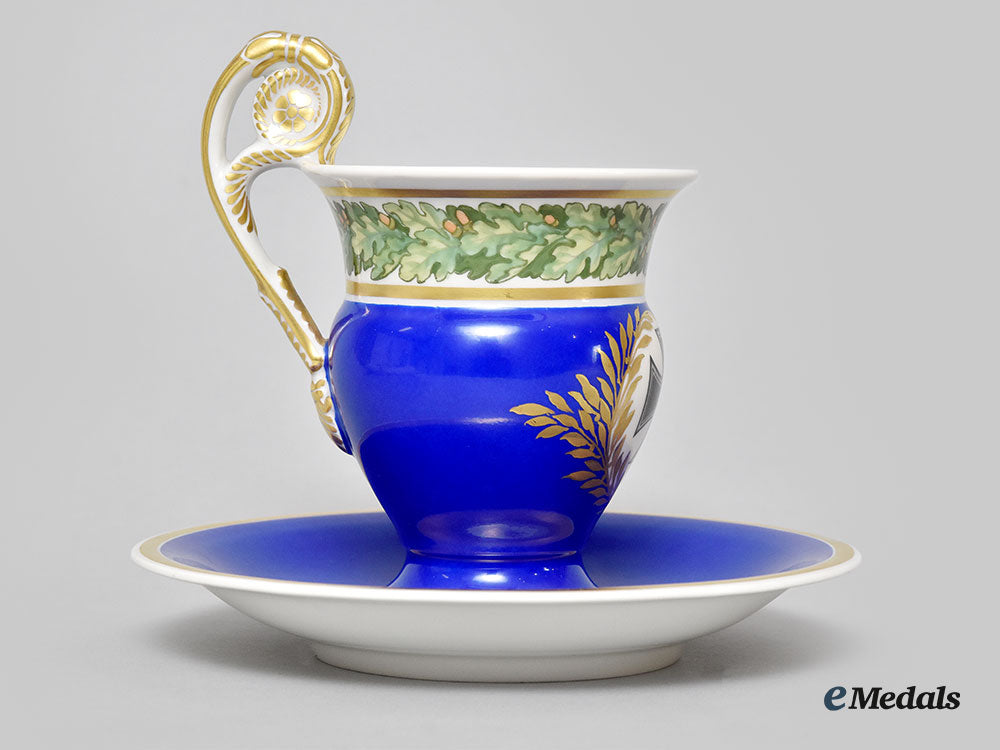 germany,_imperial._a_blue_glazed_iron_cross_motif_teacup_set,_by_kpm_l22_mnc9198_364
