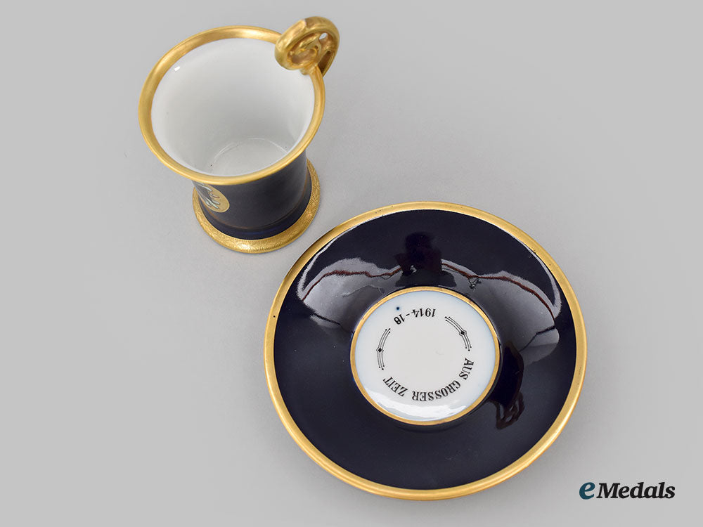 germany,_imperial._a_blue_glazed_teacup_and_saucer_with_iron_cross_depiction,_by_pt_tirschenreuth,_c.1930_l22_mnc9327_637_1