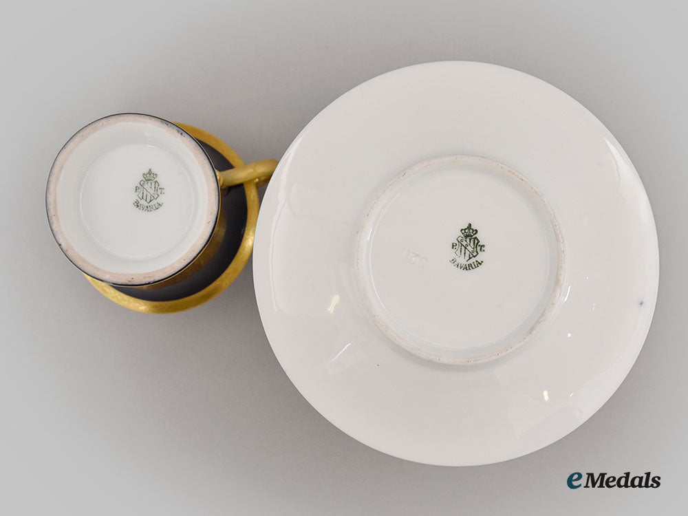 germany,_imperial._a_blue_glazed_teacup_and_saucer_with_iron_cross_depiction,_by_pt_tirschenreuth,_c.1930_l22_mnc9330_636_1