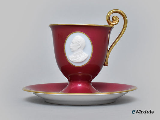 germany,_imperial._a_red_glazed_teacup_and_saucer_with_hindenburg_relief,_by_hutschenreuther,1916_l22_mnc9349_630_1