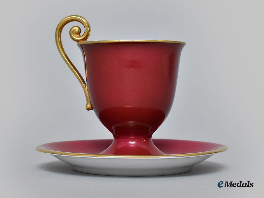 germany,_imperial._a_red_glazed_teacup_and_saucer_with_hindenburg_relief,_by_hutschenreuther,1916_l22_mnc9350_629_1