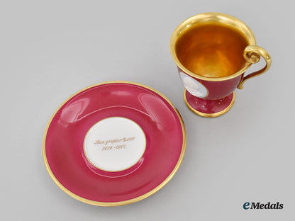germany,_imperial._a_red_glazed_teacup_and_saucer_with_hindenburg_relief,_by_hutschenreuther,1916_l22_mnc9354_627_1