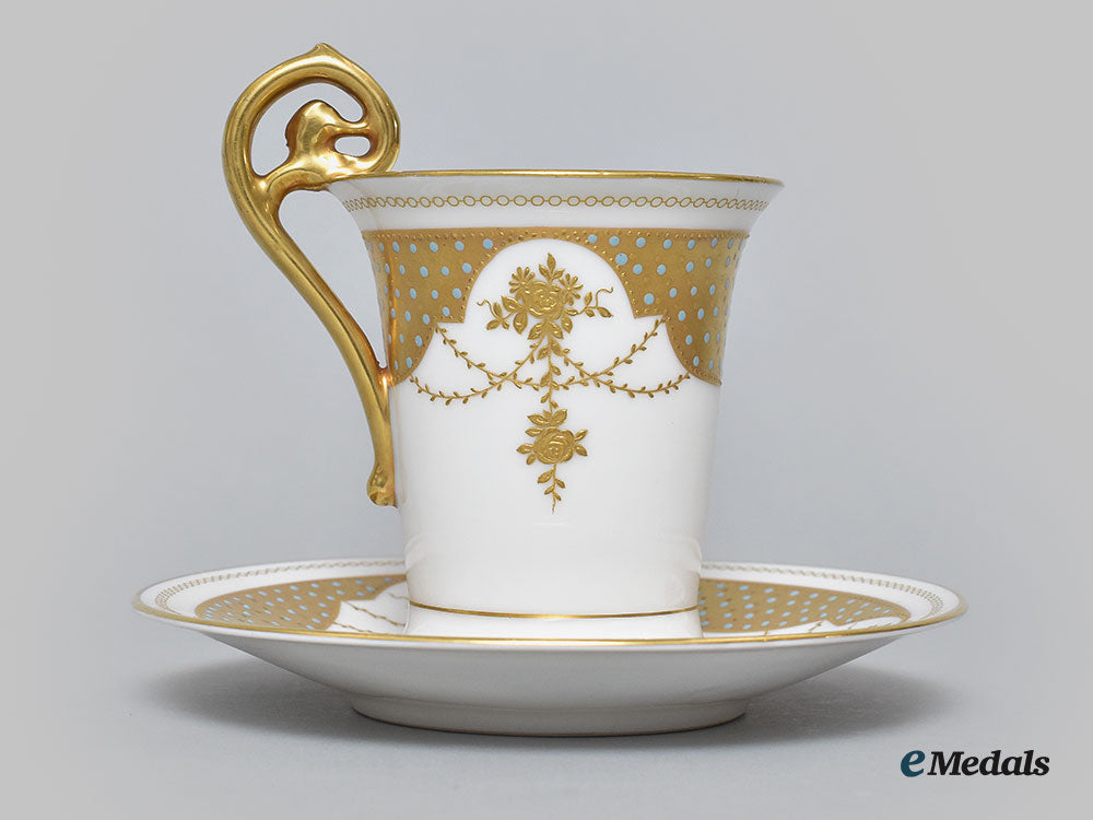 germany,_imperial._a_decorative_iron_cross_teacup_and_saucer_with_floral_motifs,_by_rosenthal_l22_mnc9361_625_1
