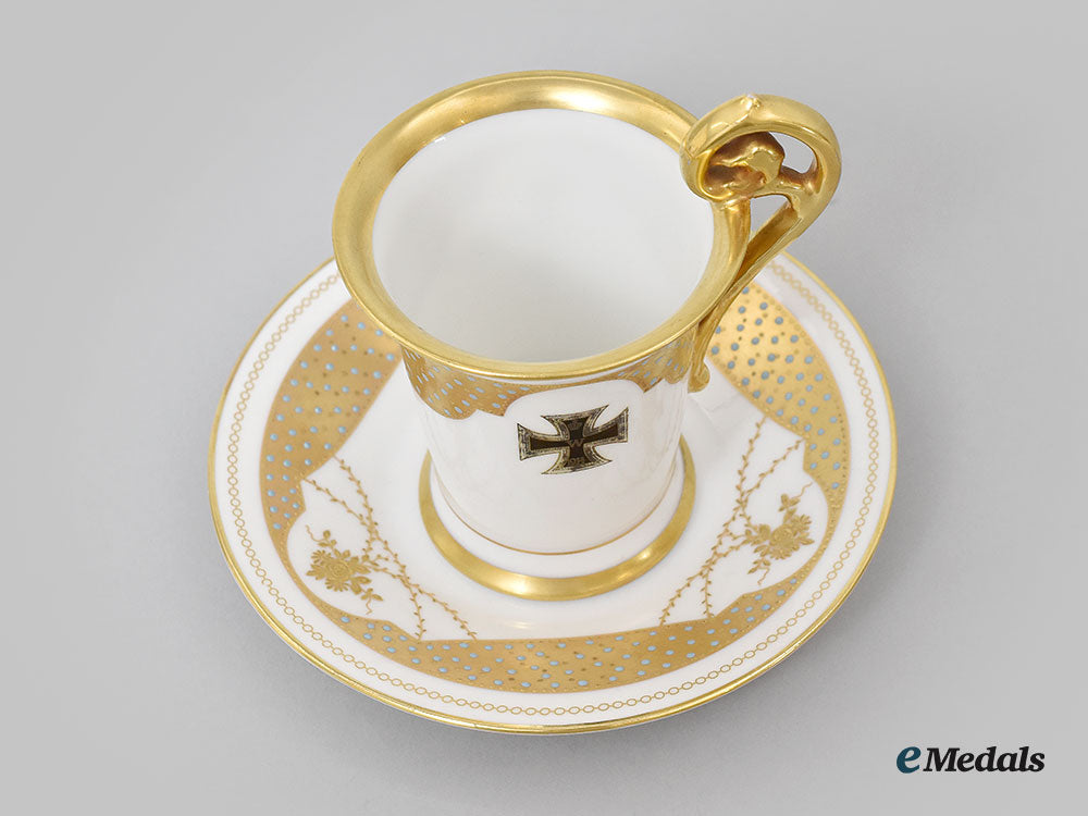 germany,_imperial._a_decorative_iron_cross_teacup_and_saucer_with_floral_motifs,_by_rosenthal_l22_mnc9365_623_1