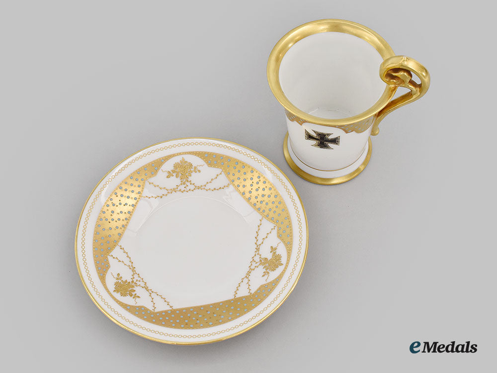germany,_imperial._a_decorative_iron_cross_teacup_and_saucer_with_floral_motifs,_by_rosenthal_l22_mnc9366_622_1
